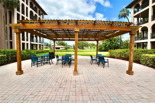 6150 Gulfport Blvd S Unit 302, Gulfport, FL 33707 - view of patio / terrace featuring outdoor dining area and a pergola