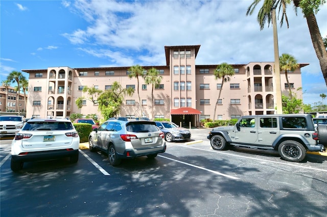 6150 Gulfport Blvd S Unit 302, Gulfport, FL 33707 - view of building exterior with uncovered parking