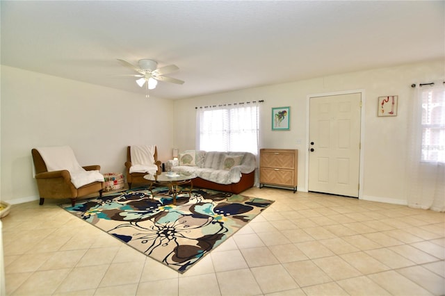 6150 Gulfport Blvd S Unit 302, Gulfport, FL 33707 - living area featuring tile patterned floors, a ceiling fan, and baseboards
