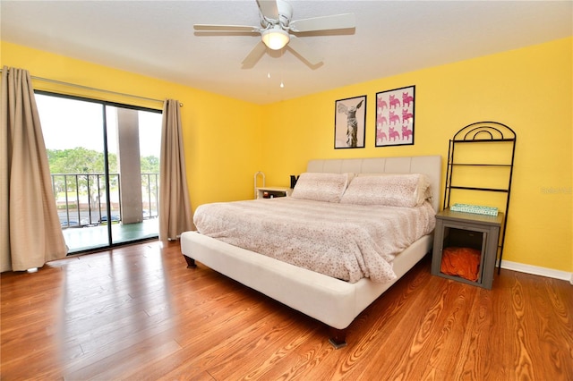 6150 Gulfport Blvd S Unit 302, Gulfport, FL 33707 - bedroom with access to outside, wood finished floors, baseboards, and a ceiling fan