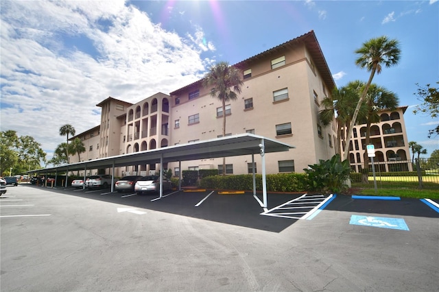 6150 Gulfport Blvd S Unit 302, Gulfport, FL 33707 - view of building exterior with covered and uncovered parking