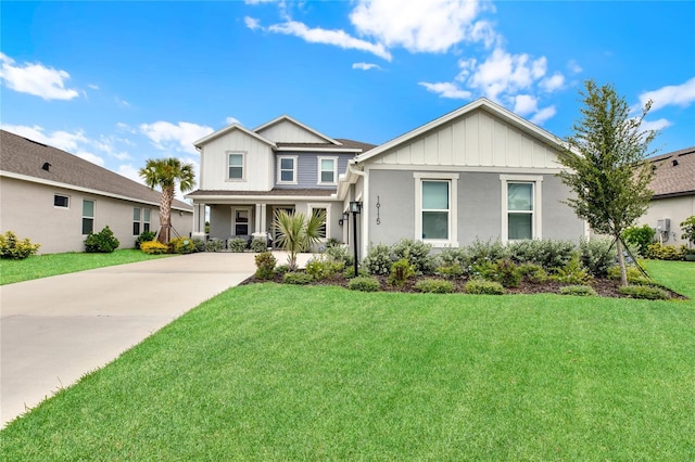 view of front of house featuring a front yard and concrete driveway