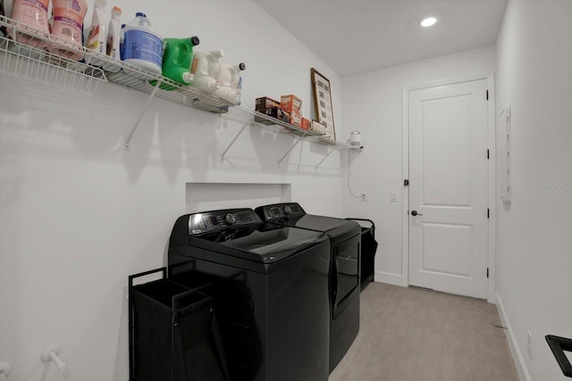 clothes washing area with washer and dryer, recessed lighting, and baseboards