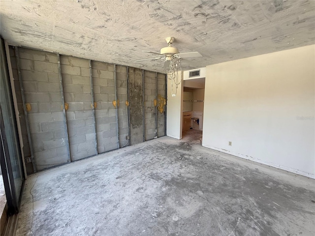 2621 Cove Cay Dr Unit 206, Clearwater, FL 33760 - unfurnished bedroom featuring concrete flooring, ceiling fan, and concrete block wall