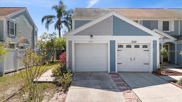 12307 Villager Ct, Tampa, FL 33625 - garage with concrete driveway and fence