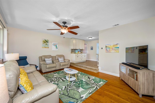3749 Mckay Creek Dr, Largo, FL 33770 - living area with light wood-type flooring, a ceiling fan, and baseboards