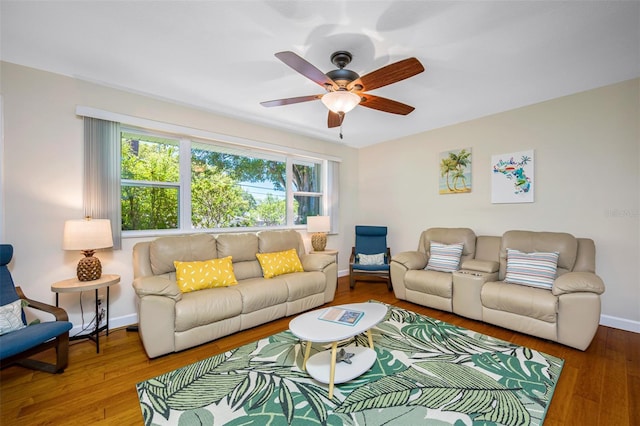 3749 Mckay Creek Dr, Largo, FL 33770 - living area featuring a ceiling fan, wood finished floors, and baseboards
