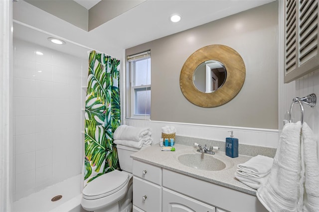 3749 Mckay Creek Dr, Largo, FL 33770 - full bathroom with vanity, toilet, a tile shower, and recessed lighting