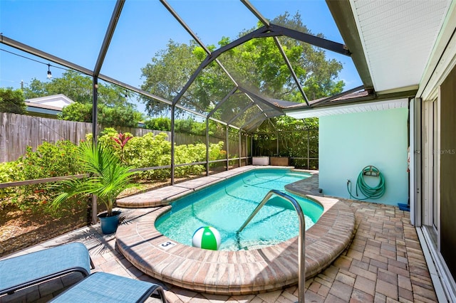 3749 Mckay Creek Dr, Largo, FL 33770 - view of pool featuring a fenced backyard, glass enclosure, and a patio area
