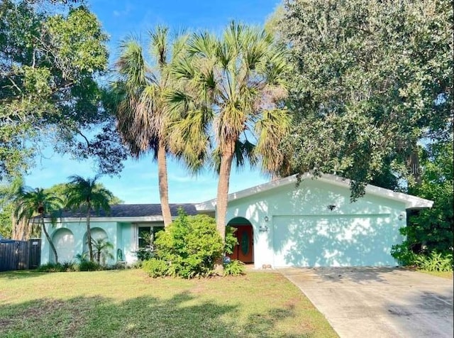 3749 Mckay Creek Dr, Largo, FL 33770 - single story home with an attached garage, driveway, and stucco siding