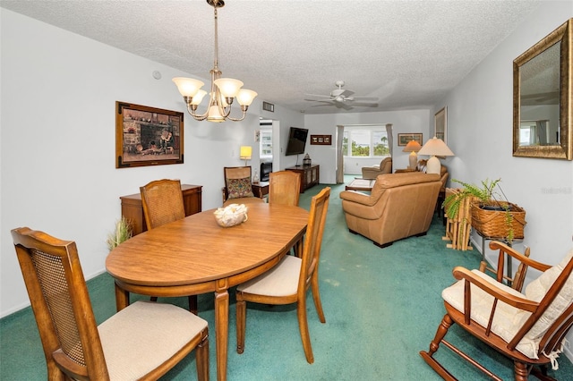 8 Glencoe Pl Unit 305, Dunedin, FL 34698 - dining space with carpet floors, a textured ceiling, a chandelier, and ceiling fan