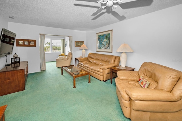 8 Glencoe Pl Unit 305, Dunedin, FL 34698 - carpeted living area featuring a textured ceiling and a ceiling fan