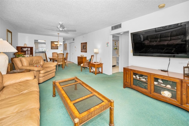 8 Glencoe Pl Unit 305, Dunedin, FL 34698 - living room featuring carpet flooring, a ceiling fan, and a textured ceiling
