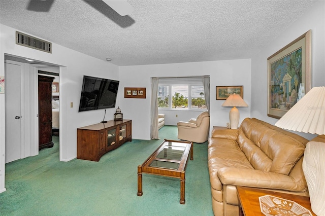 8 Glencoe Pl Unit 305, Dunedin, FL 34698 - carpeted living room with a textured ceiling