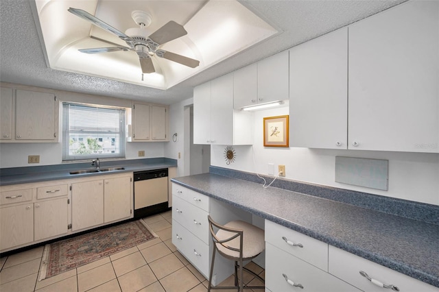 8 Glencoe Pl Unit 305, Dunedin, FL 34698 - kitchen featuring white dishwasher, a sink, light tile patterned floors, a ceiling fan, and dark countertops