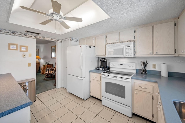 8 Glencoe Pl Unit 305, Dunedin, FL 34698 - kitchen featuring white appliances, a ceiling fan, light tile patterned floors, and a textured ceiling