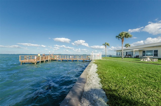 8 Glencoe Pl Unit 305, Dunedin, FL 34698 - dock area with a water view and a yard