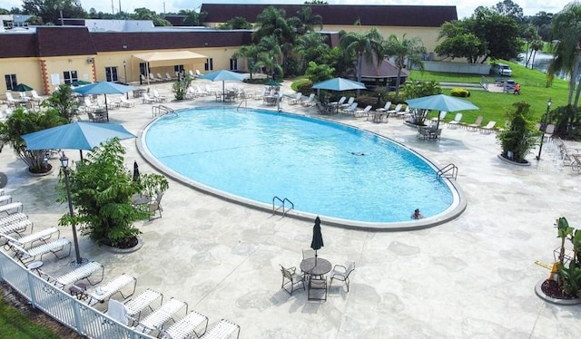 community pool featuring a patio area