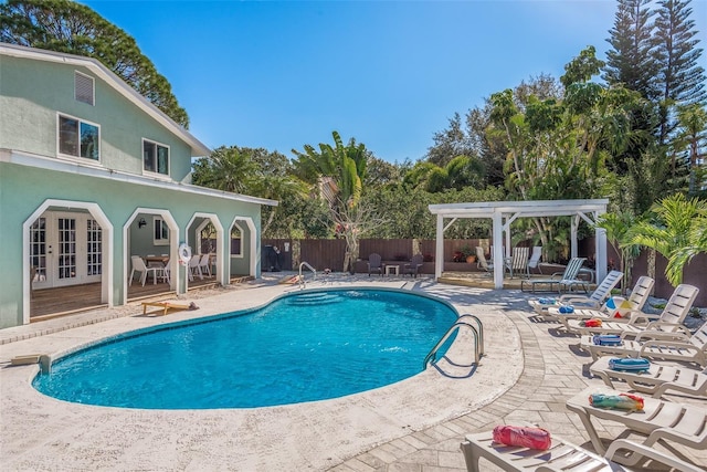 8240 144th Ln, Seminole, FL 33776 - view of swimming pool with a pergola, a patio area, and french doors