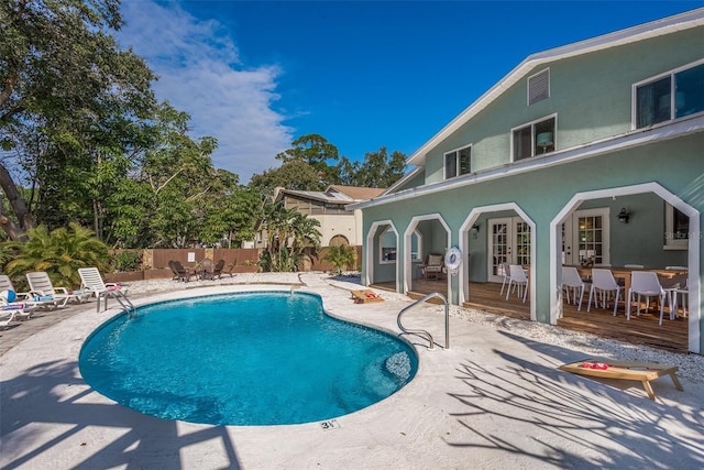 8240 144th Ln, Seminole, FL 33776 - view of pool with a patio, a deck, french doors, and outdoor dining area