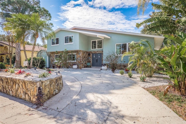 8240 144th Ln, Seminole, FL 33776 - view of front facade with stucco siding and stone siding