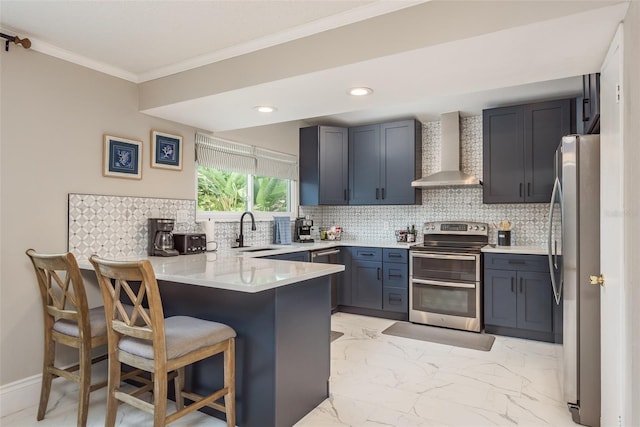 8240 144th Ln, Seminole, FL 33776 - kitchen featuring wall chimney exhaust hood, appliances with stainless steel finishes, a sink, a peninsula, and light marble finish floors