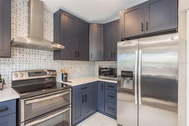 8240 144th Ln, Seminole, FL 33776 - kitchen with stainless steel appliances, wall chimney exhaust hood, light marble finish floors, light countertops, and backsplash