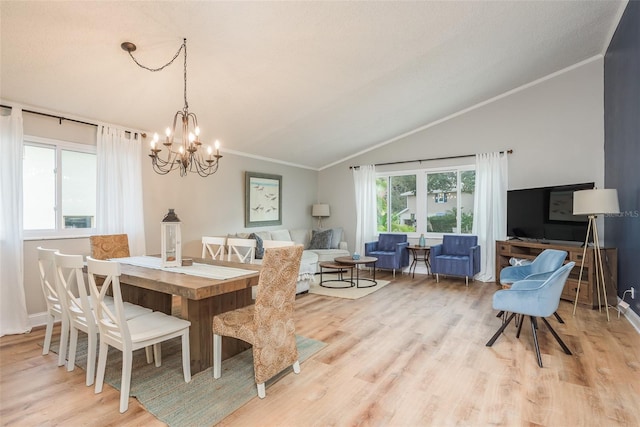 8240 144th Ln, Seminole, FL 33776 - dining room with vaulted ceiling, a chandelier, light wood-style flooring, and ornamental molding