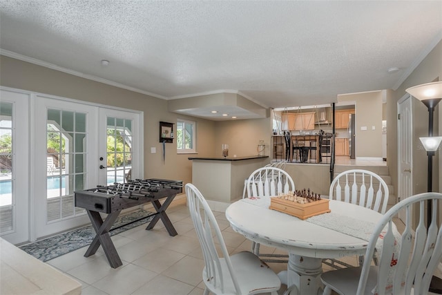 8240 144th Ln, Seminole, FL 33776 - dining space with ornamental molding, french doors, a textured ceiling, and light tile patterned floors