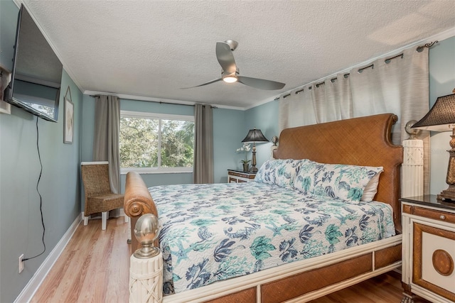 8240 144th Ln, Seminole, FL 33776 - bedroom featuring wood finished floors, baseboards, a textured ceiling, crown molding, and a ceiling fan