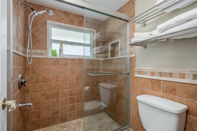8240 144th Ln, Seminole, FL 33776 - bathroom with a stall shower, toilet, and a wainscoted wall