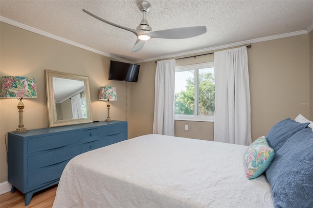 8240 144th Ln, Seminole, FL 33776 - bedroom featuring ornamental molding, light wood finished floors, a textured ceiling, and ceiling fan