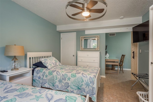 8240 144th Ln, Seminole, FL 33776 - bedroom with a textured ceiling and ceiling fan