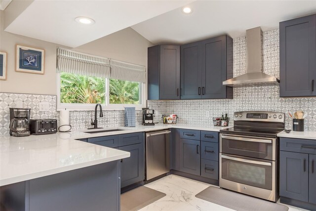 8240 144th Ln, Seminole, FL 33776 - kitchen with wall chimney exhaust hood, appliances with stainless steel finishes, a sink, light marble finish floors, and light countertops