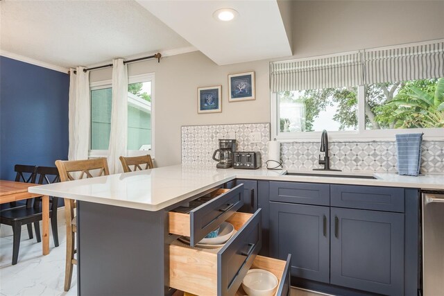 8240 144th Ln, Seminole, FL 33776 - kitchen with a sink, a peninsula, tasteful backsplash, crown molding, and light countertops