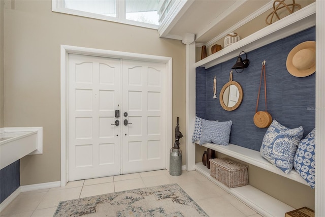 8240 144th Ln, Seminole, FL 33776 - mudroom featuring tile patterned floors and baseboards