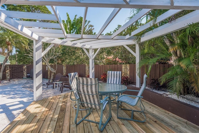 8240 144th Ln, Seminole, FL 33776 - wooden terrace featuring a fenced backyard, a pergola, and outdoor dining area