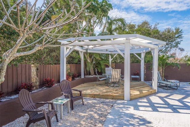 8240 144th Ln, Seminole, FL 33776 - view of patio / terrace featuring a wooden deck and a pergola