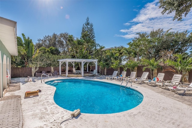 8240 144th Ln, Seminole, FL 33776 - view of swimming pool featuring a pergola, a patio, and a fenced backyard