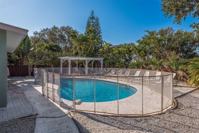 8240 144th Ln, Seminole, FL 33776 - view of swimming pool with a pergola and a patio area