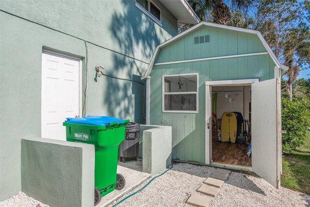 8240 144th Ln, Seminole, FL 33776 - view of home's exterior with an outbuilding