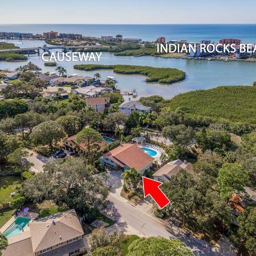 8240 144th Ln, Seminole, FL 33776 - aerial view of property and surrounding area featuring a large body of water and a pool area
