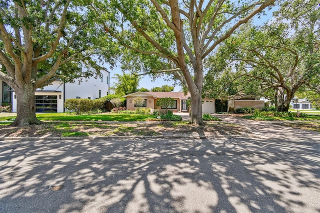 750 Alda Way NE, Saint Petersburg, FL 33704 - view of front of house featuring an attached garage and driveway