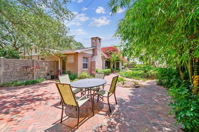 750 Alda Way NE, Saint Petersburg, FL 33704 - view of patio featuring fence and outdoor dining area