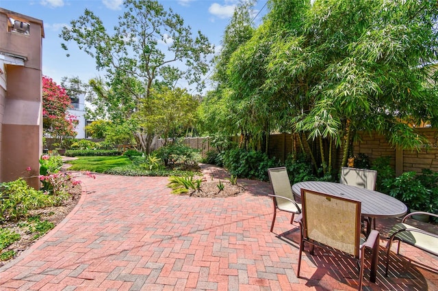 750 Alda Way NE, Saint Petersburg, FL 33704 - view of patio / terrace featuring a fenced backyard and outdoor dining area