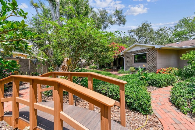 750 Alda Way NE, Saint Petersburg, FL 33704 - view of yard with a wooden deck and fence