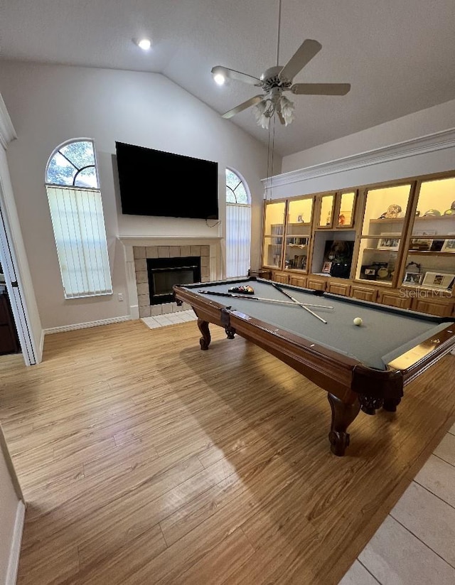 2528 Deerbrook Dr, Lakeland, FL 33811 - game room featuring vaulted ceiling, billiards, a fireplace, ceiling fan, and wood finished floors