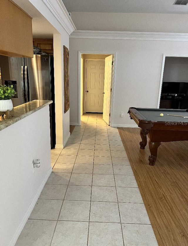 2528 Deerbrook Dr, Lakeland, FL 33811 - hallway featuring light tile patterned flooring, crown molding, and baseboards