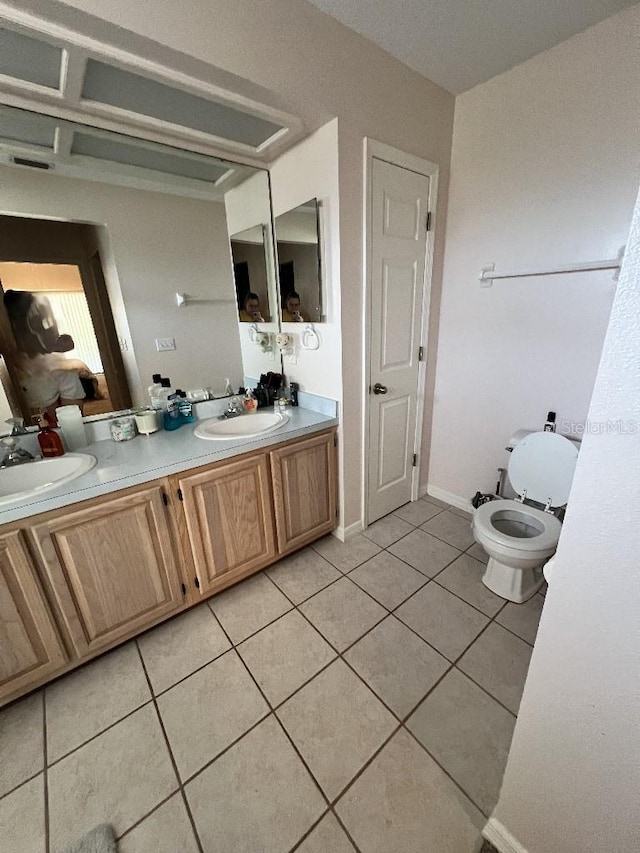 2528 Deerbrook Dr, Lakeland, FL 33811 - bathroom with tile patterned flooring, double vanity, and toilet