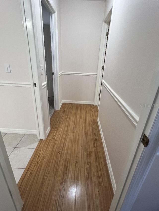 2528 Deerbrook Dr, Lakeland, FL 33811 - hall with wood finished floors and baseboards